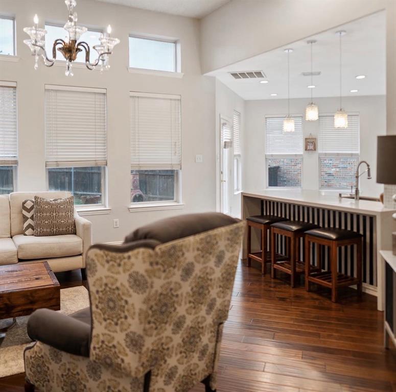 1424 Winston Drive McKinney, TX 75072 - Photo 11 of 28 a living room with furniture and a wooden floor