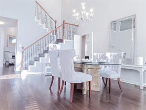 1424 Winston Drive McKinney, TX 75072 - Photo 14 of 28 a view of a dining room with furniture and wooden floor