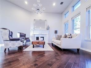 1424 Winston Drive McKinney, TX 75072 - Photo 15 of 28 a living room with furniture and a fireplace