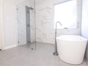 1424 Winston Drive McKinney, TX 75072 - Photo 23 of 28 a bathroom with a shower