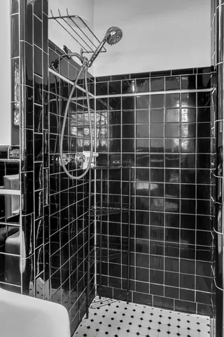 a view of a black and white wooden building