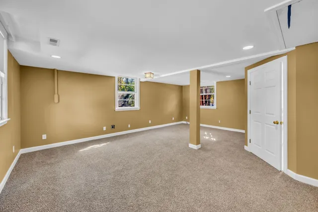 a view of an empty room with windows