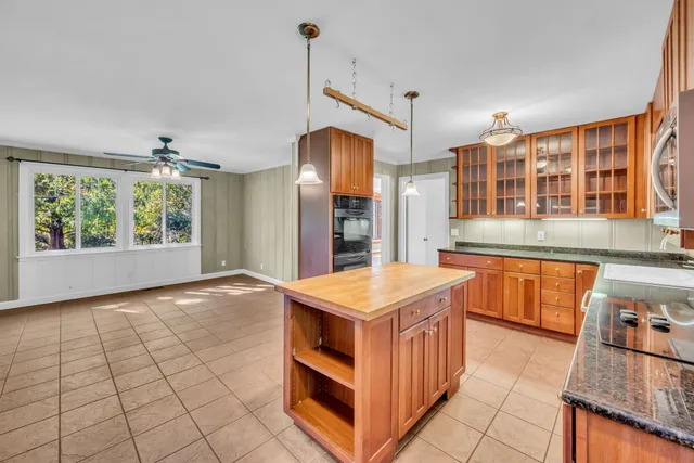 a kitchen that has a lot of cabinets in it