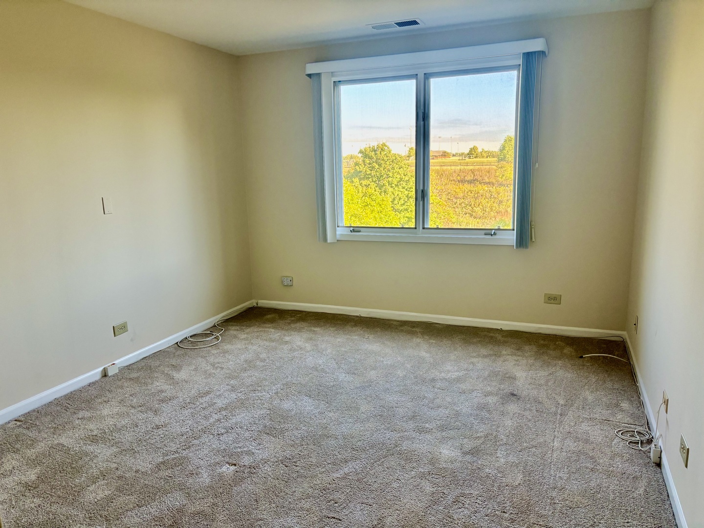 2000 Chestnut Avenue, Unit 407 Glenview, IL 60025 - Photo 13 of 25 an empty room with a window