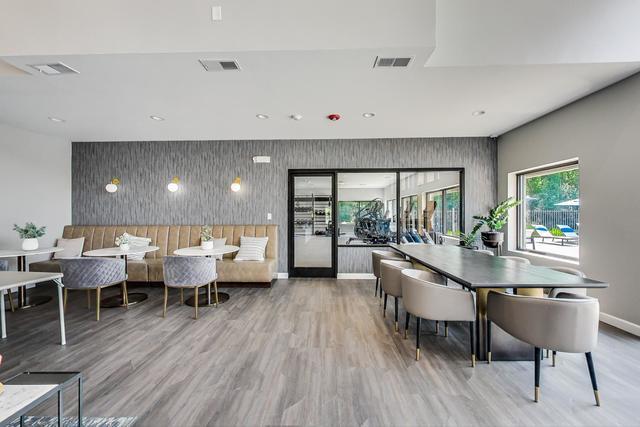 2000 Chestnut Avenue, Unit 407 Glenview, IL 60025 - Photo 18 of 25 a living room with lots of furniture and a wooden floor