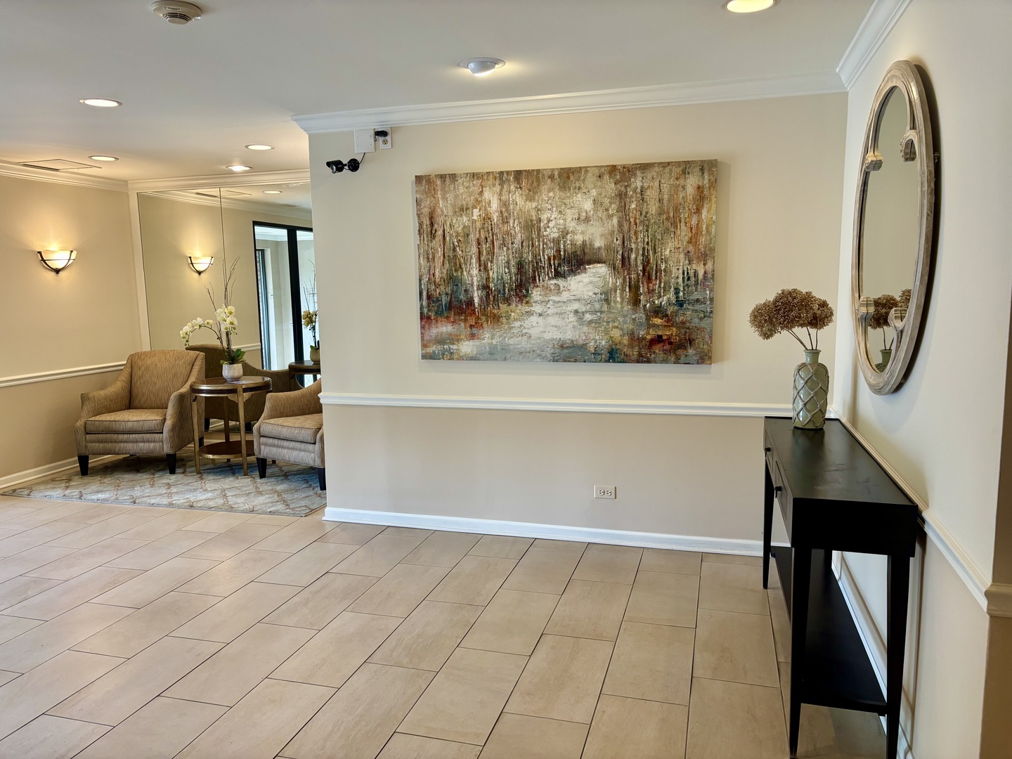 2000 Chestnut Avenue, Unit 407 Glenview, IL 60025 - Photo 3 of 25 a view of living room with furniture and a painting