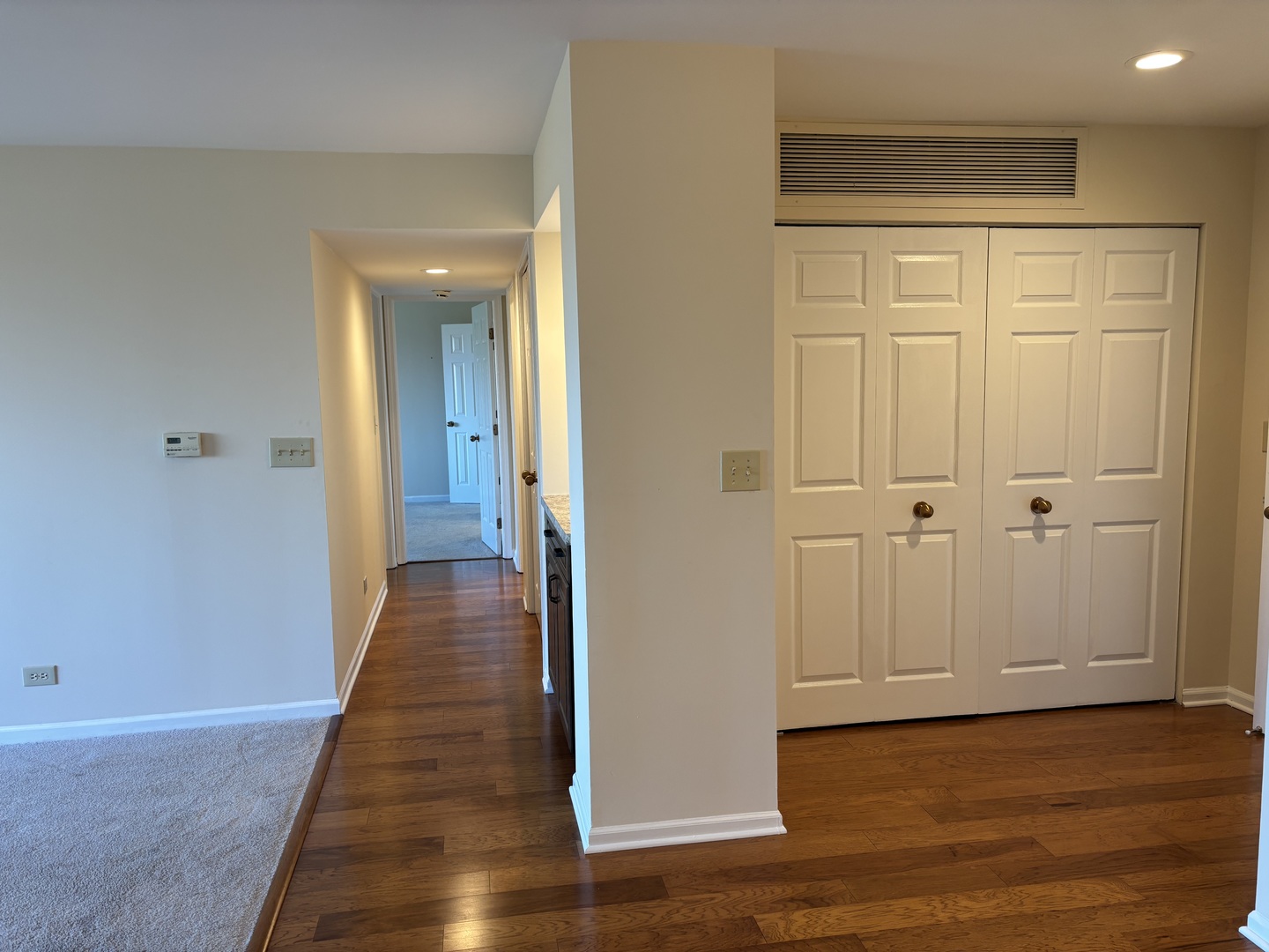 2000 Chestnut Avenue, Unit 407 Glenview, IL 60025 - Photo 8 of 25 a view of a hallway with wooden floor and closet