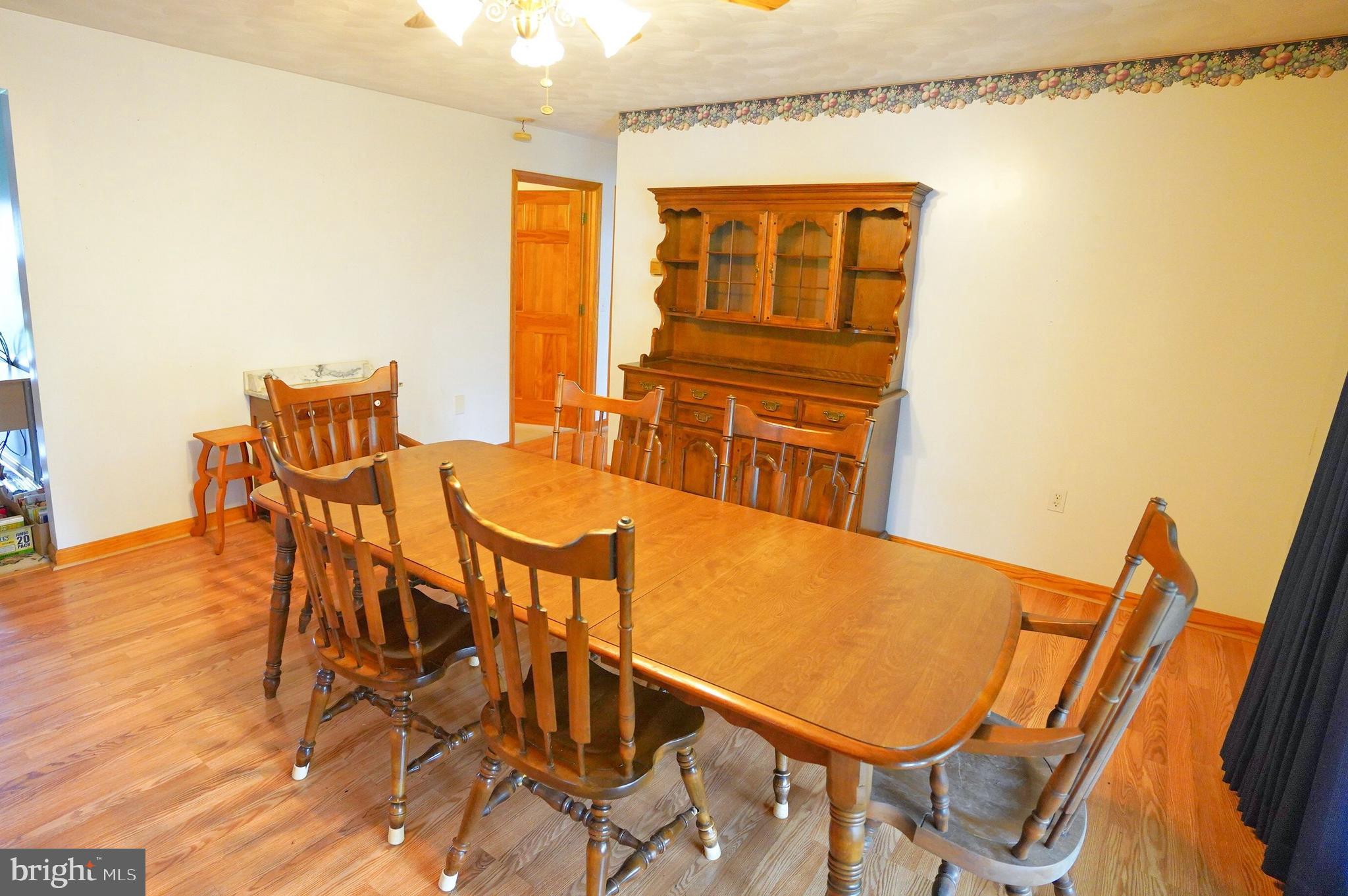 775 East Berlin Road York Springs, PA 17372 - Photo 12 of 33 a view of a dining room with furniture and wooden floor
