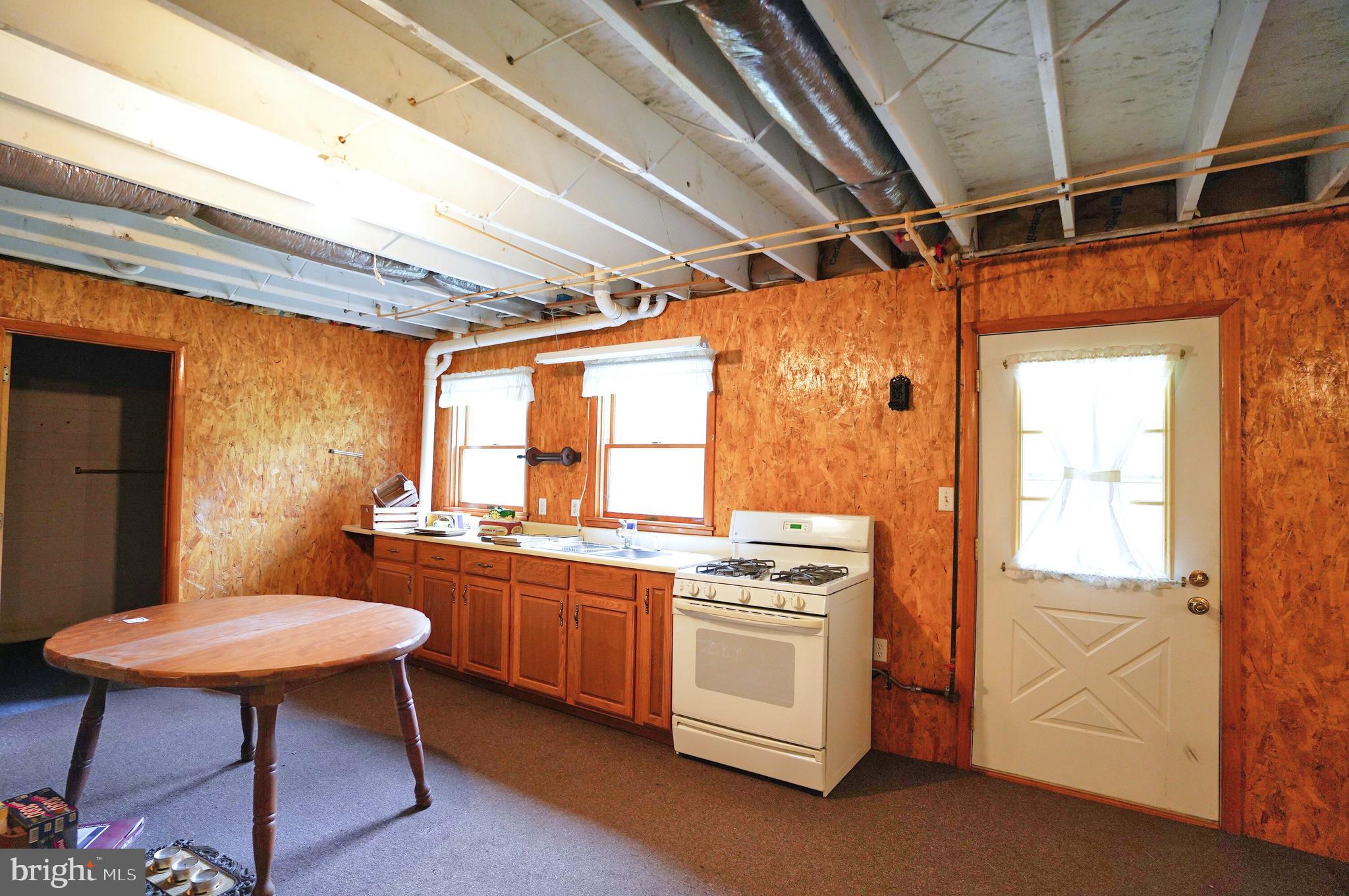 775 East Berlin Road York Springs, PA 17372 - Photo 24 of 33 a kitchen that has a stove a table and chairs in it
