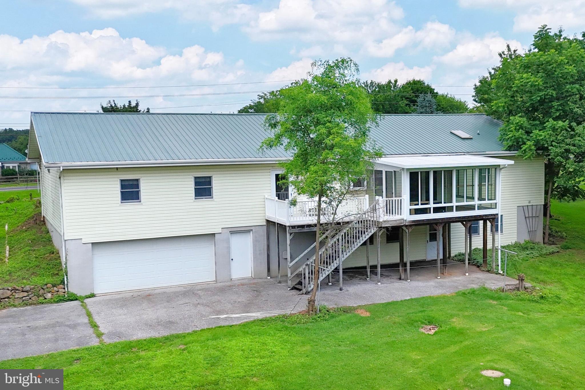 775 East Berlin Road York Springs, PA 17372 - Photo 27 of 33 a view of a house with a backyard and sitting area
