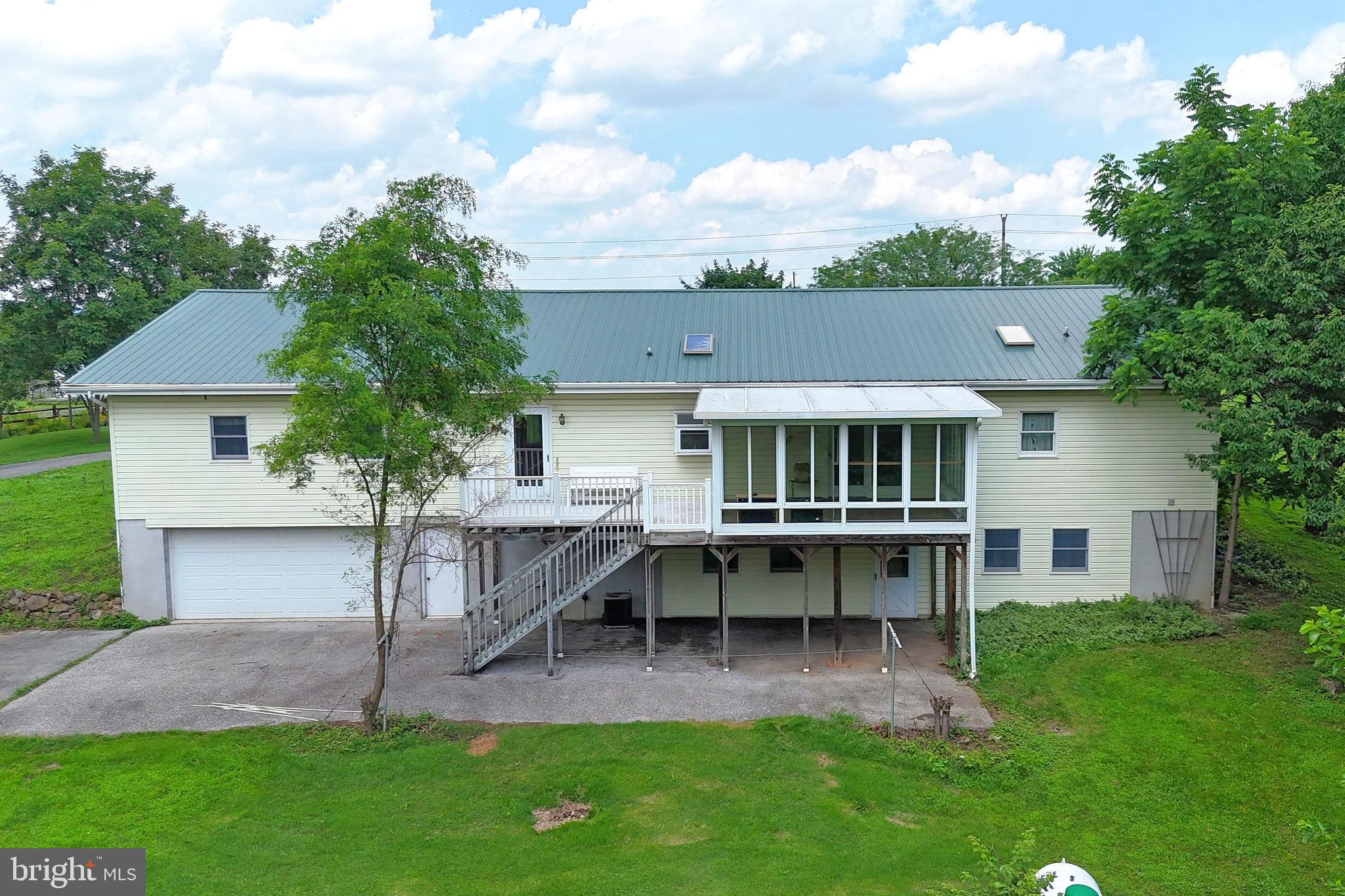775 East Berlin Road York Springs, PA 17372 - Photo 3 of 33 a view of house with a chairs and table in patio