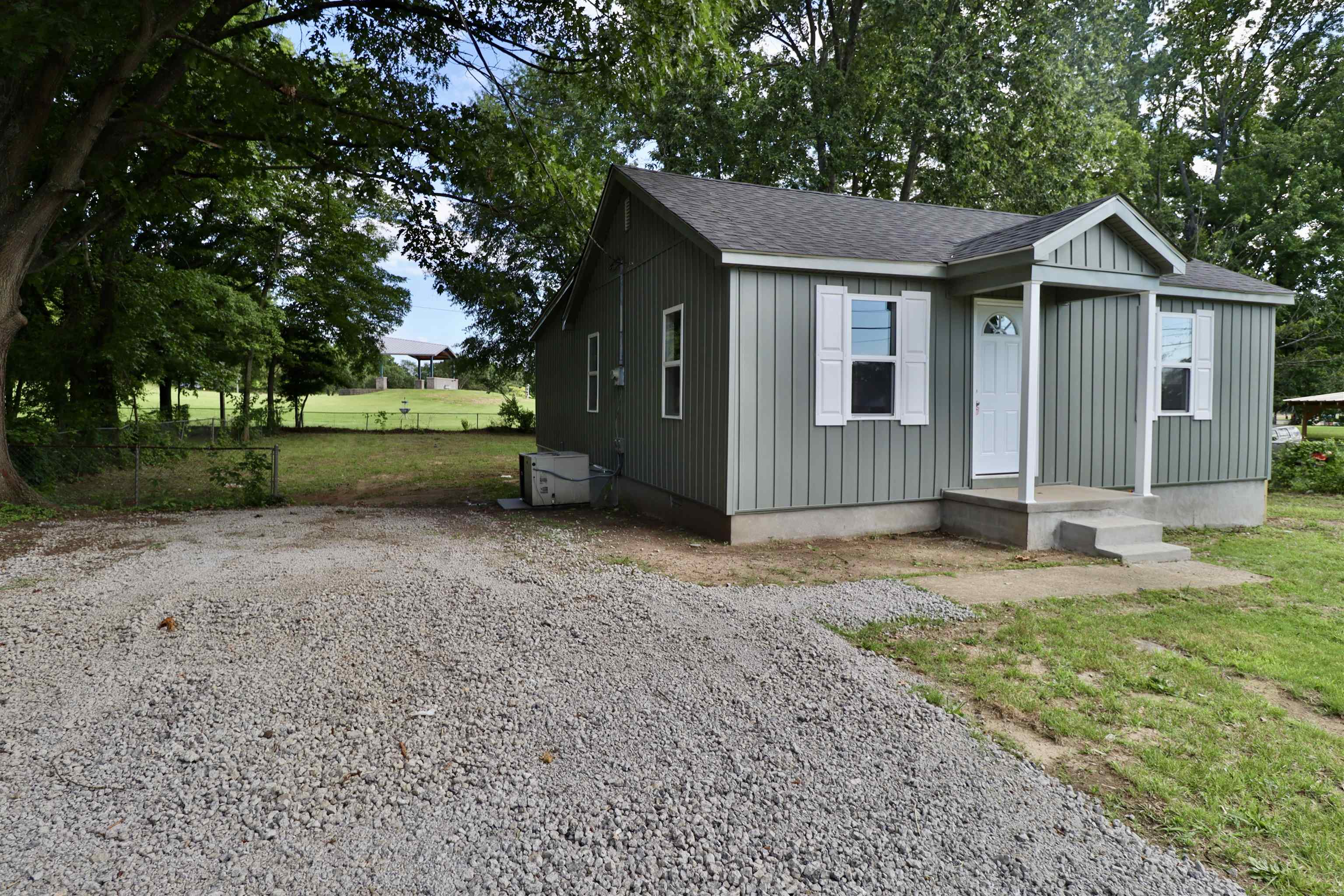 224 Kellar Avenue Ripley, TN 38063 - Photo 25 of 35 a view of a house with a yard and large tree