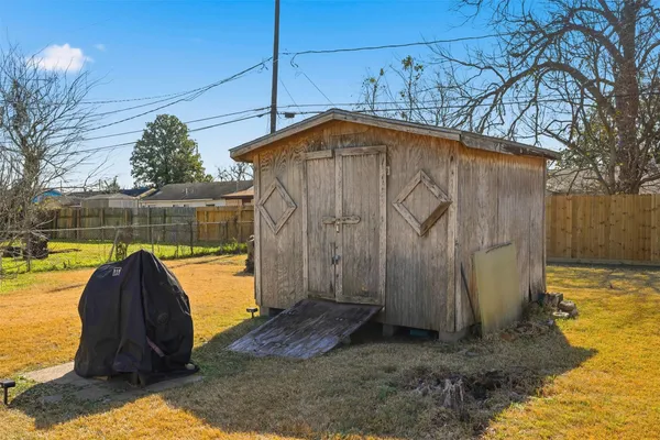 a view of a backyard with swimming pool