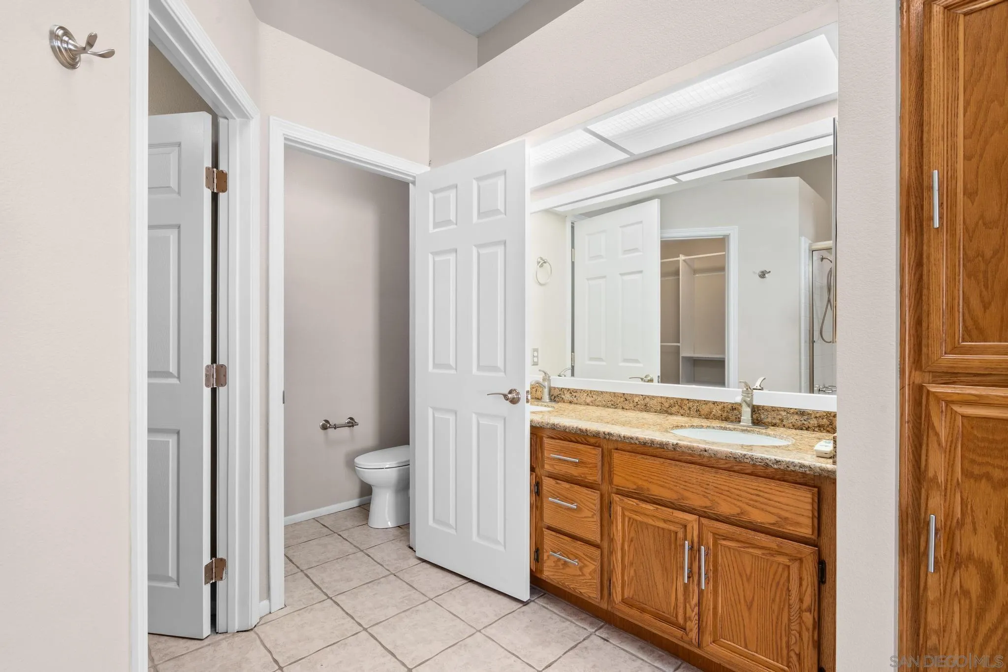 9338 Babauta Road, Unit 78 San Diego, CA 92129 - Photo 14 of 26 a spacious bathroom with a granite countertop sink toilet and shower