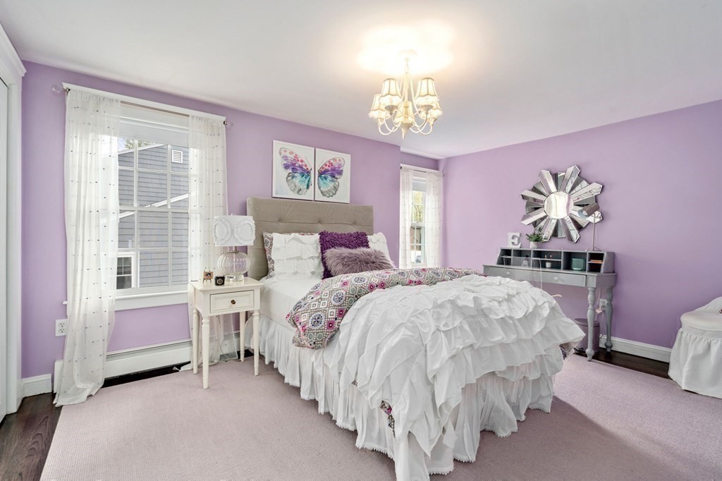 24 Tower Avenue Needham, MA 02494 - Photo 24 of 38 a bedroom with a bed chandelier and a window
