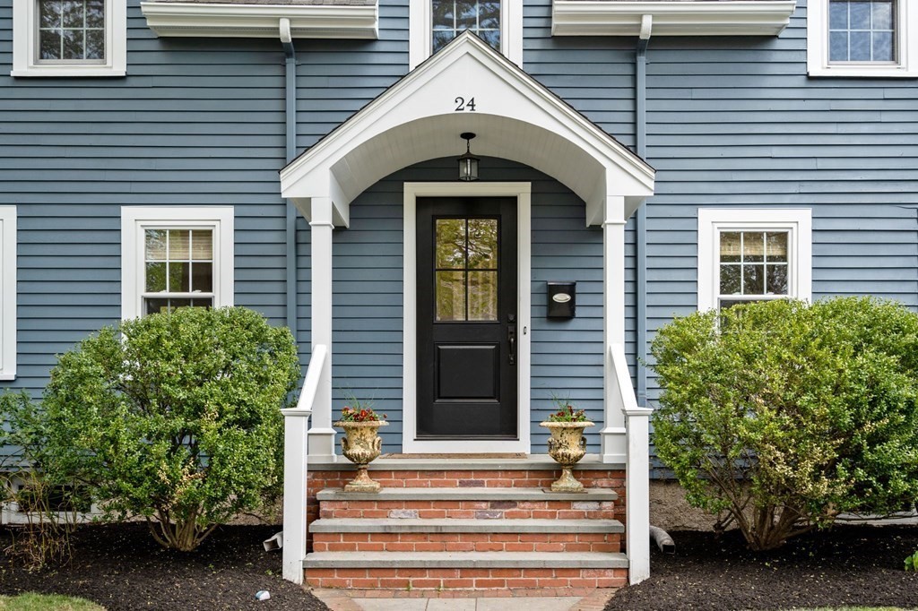 24 Tower Avenue Needham, MA 02494 - Photo 3 of 38 a front view of a house with a yard
