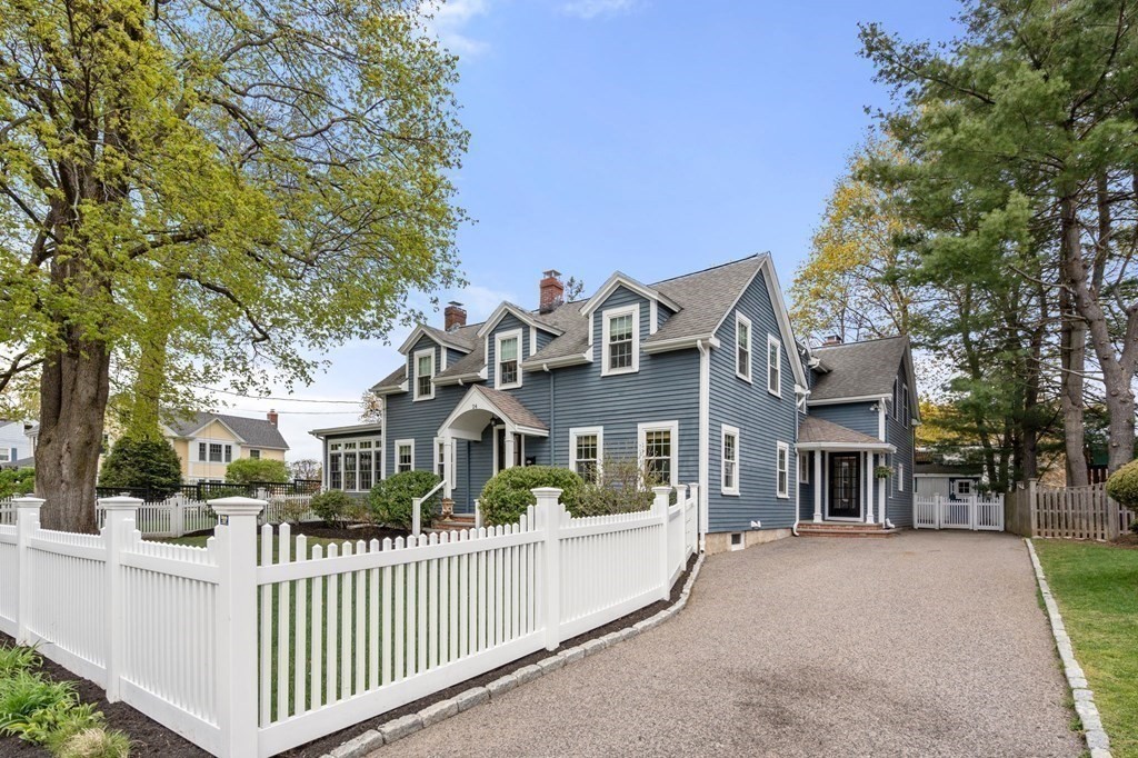 24 Tower Avenue Needham, MA 02494 - Photo 35 of 38 a front view of a house with glass windows and a tree