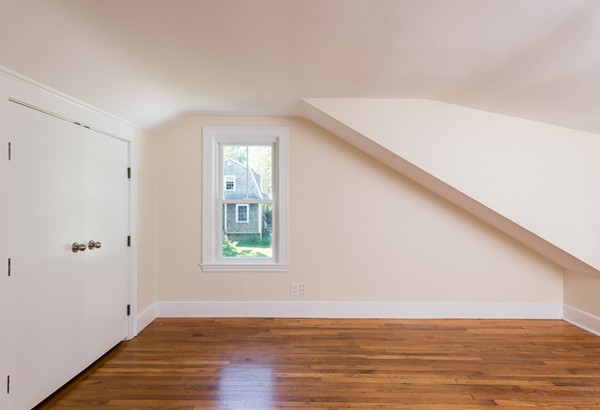 76 A First Parish Road Scituate, MA 02066 - Photo 23 of 26 a view of an empty room with wooden floor and a window