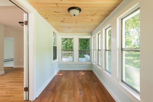 76 A First Parish Road Scituate, MA 02066 - Photo 3 of 26 a view of a room with wooden floor and windows