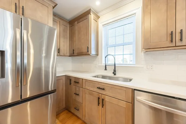 an empty room with a window and a ceiling fan