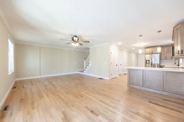 a front view of a residential apartment building with a yard