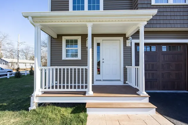 a bathroom with a toilet a sink a vanity and mirror