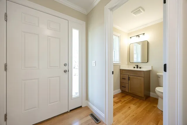 a kitchen with stainless steel appliances granite countertop a sink and a refrigerator