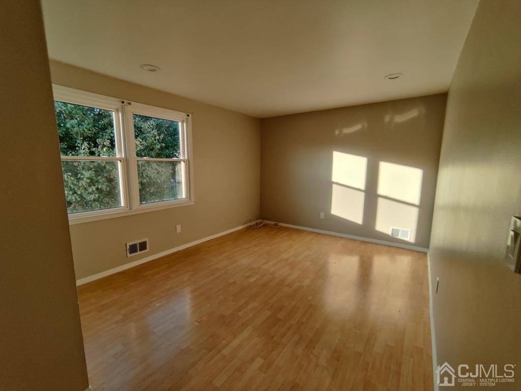 47 Brookside Road Edison, NJ 08817 - Photo 22 of 36 a view of an empty room with a window
