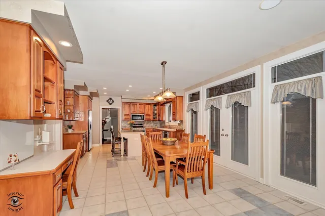 a view of a dining area with furniture window and outside view