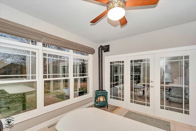 a view of a livingroom with workspace and a window