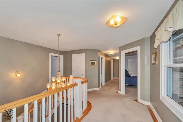 a bathroom with a bathtub sink and mirror