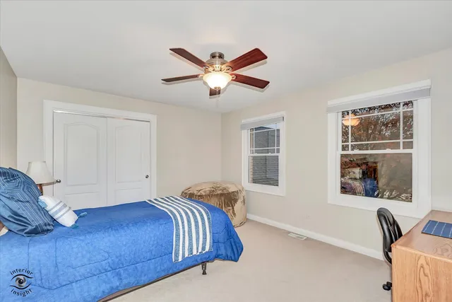 an empty room with windows and entrance