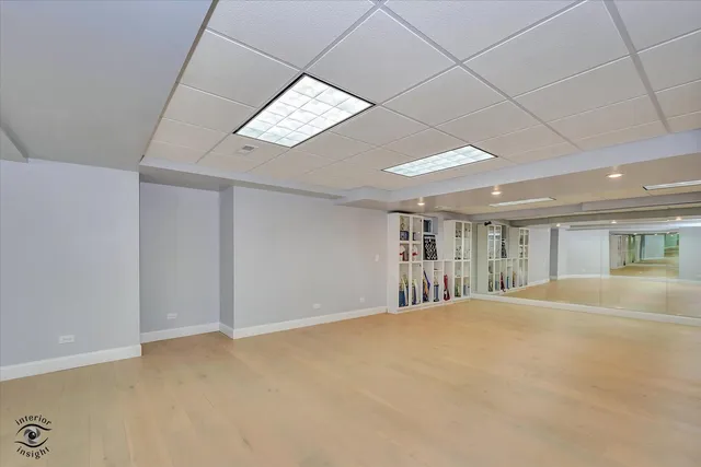 a view of an empty room with a kitchen