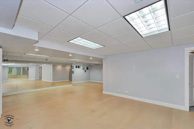 a bathroom with a double vanity sink and mirror