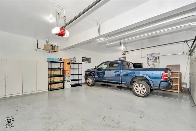 a view of a patio with table and chairs and potted plants