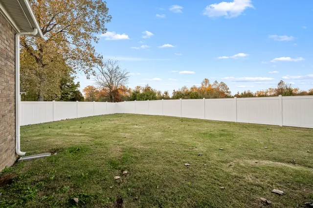 a view of patio and yard