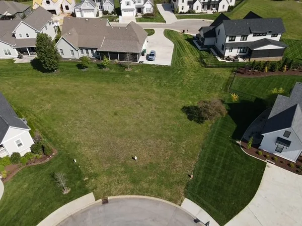 an aerial view of a house with outdoor space swimming pool