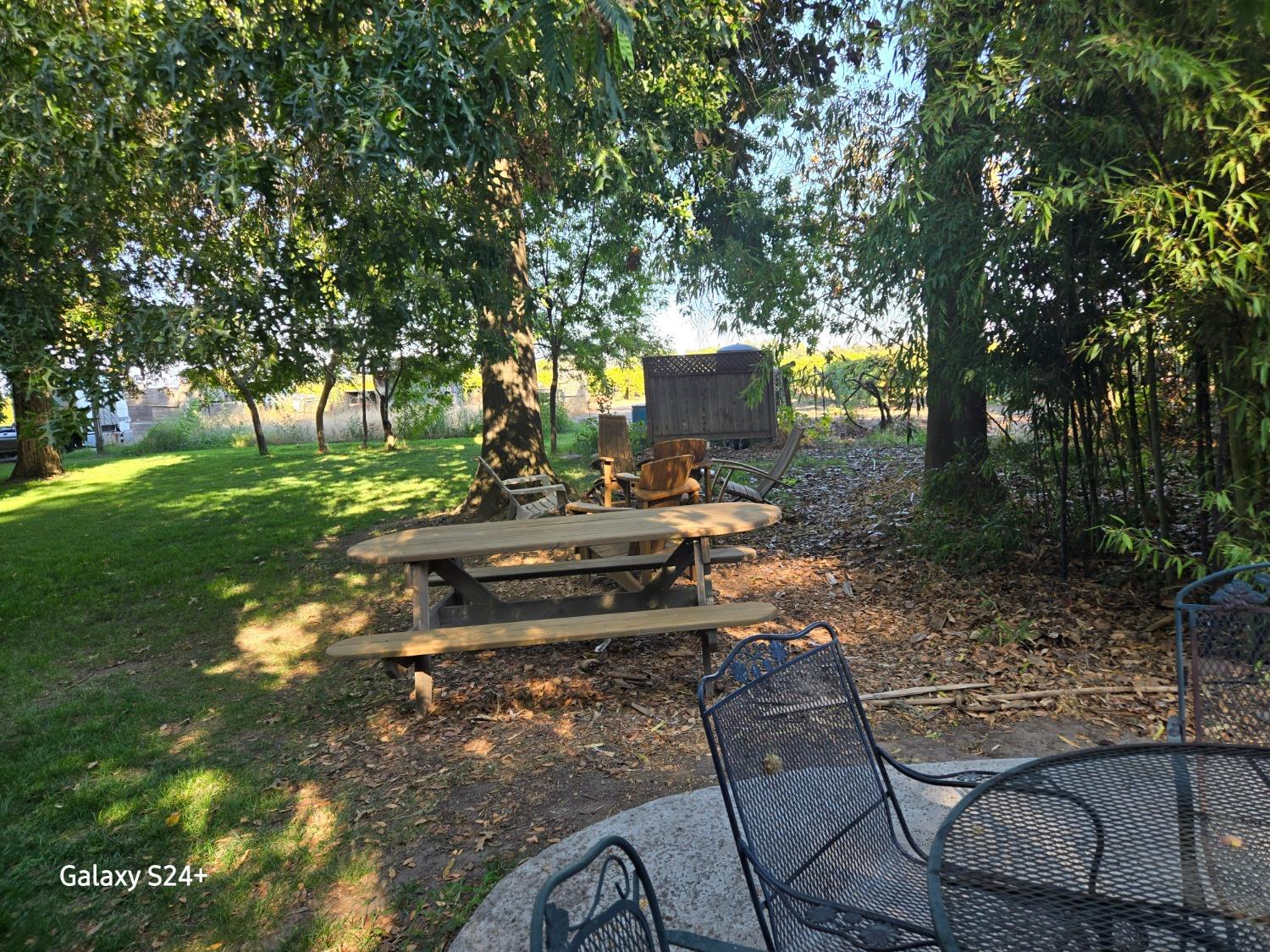 17036 North Locust Tree Road Lodi, CA 95240 - Photo 2 of 19 a view of a backyard with sitting area