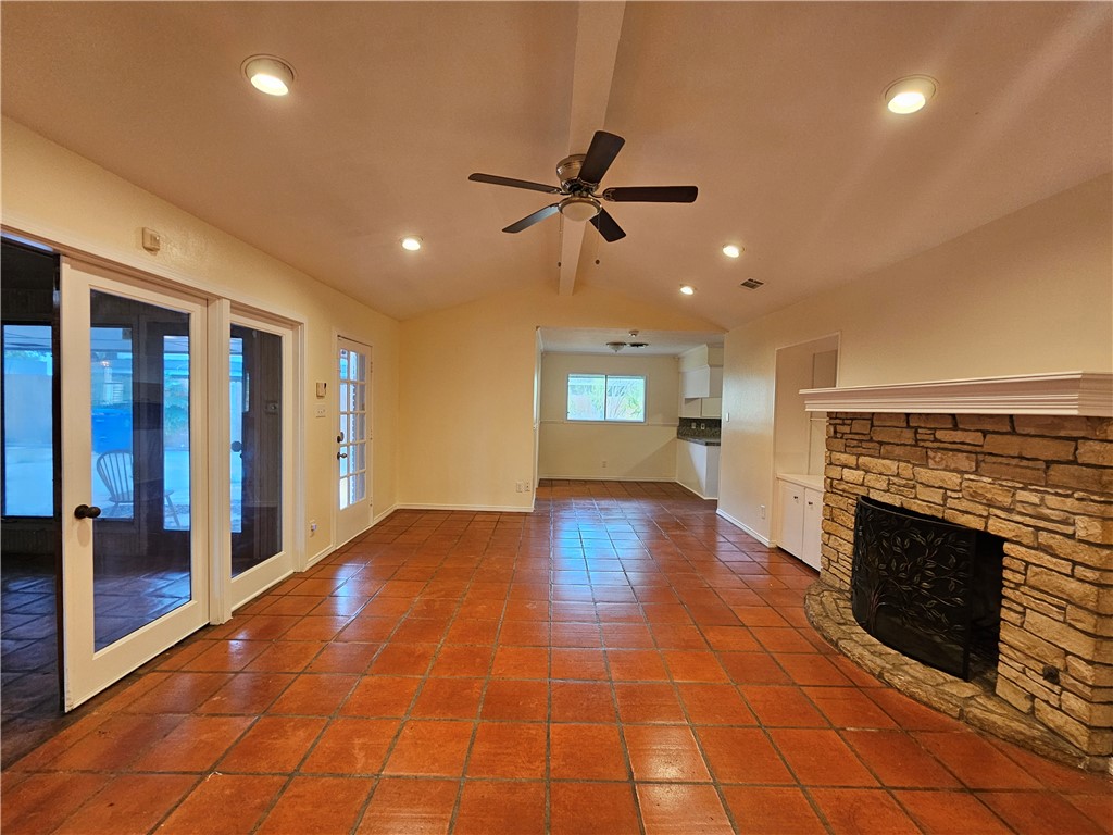 4825 Wooldridge Road Corpus Christi, TX 78413 - Photo 10 of 20 a view of empty room with wooden floor and fireplace
