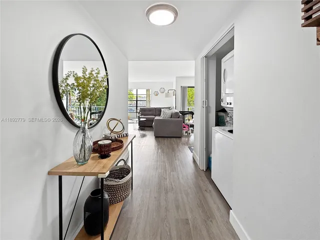 a spacious bedroom with a bed and a dresser