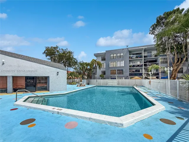 a view of building with parking space