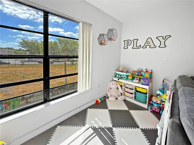 a view of a roof deck with wooden floor and fence