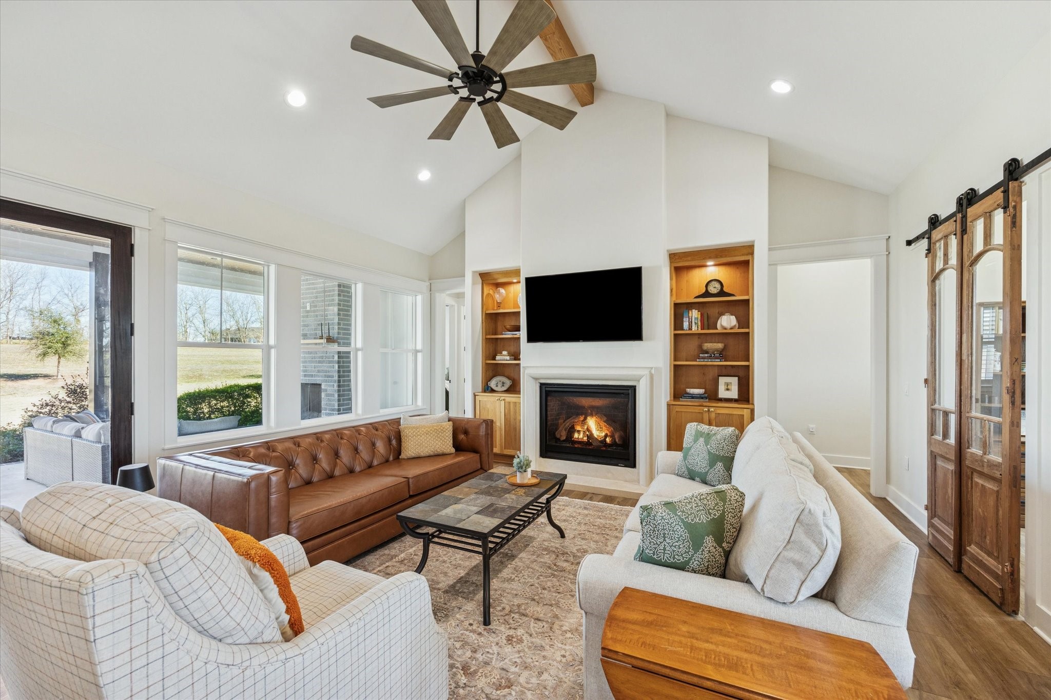 1009 Century Terrace Brenham, TX 77833 - Photo 15 of 49 a living room with furniture fireplace and a flat screen tv