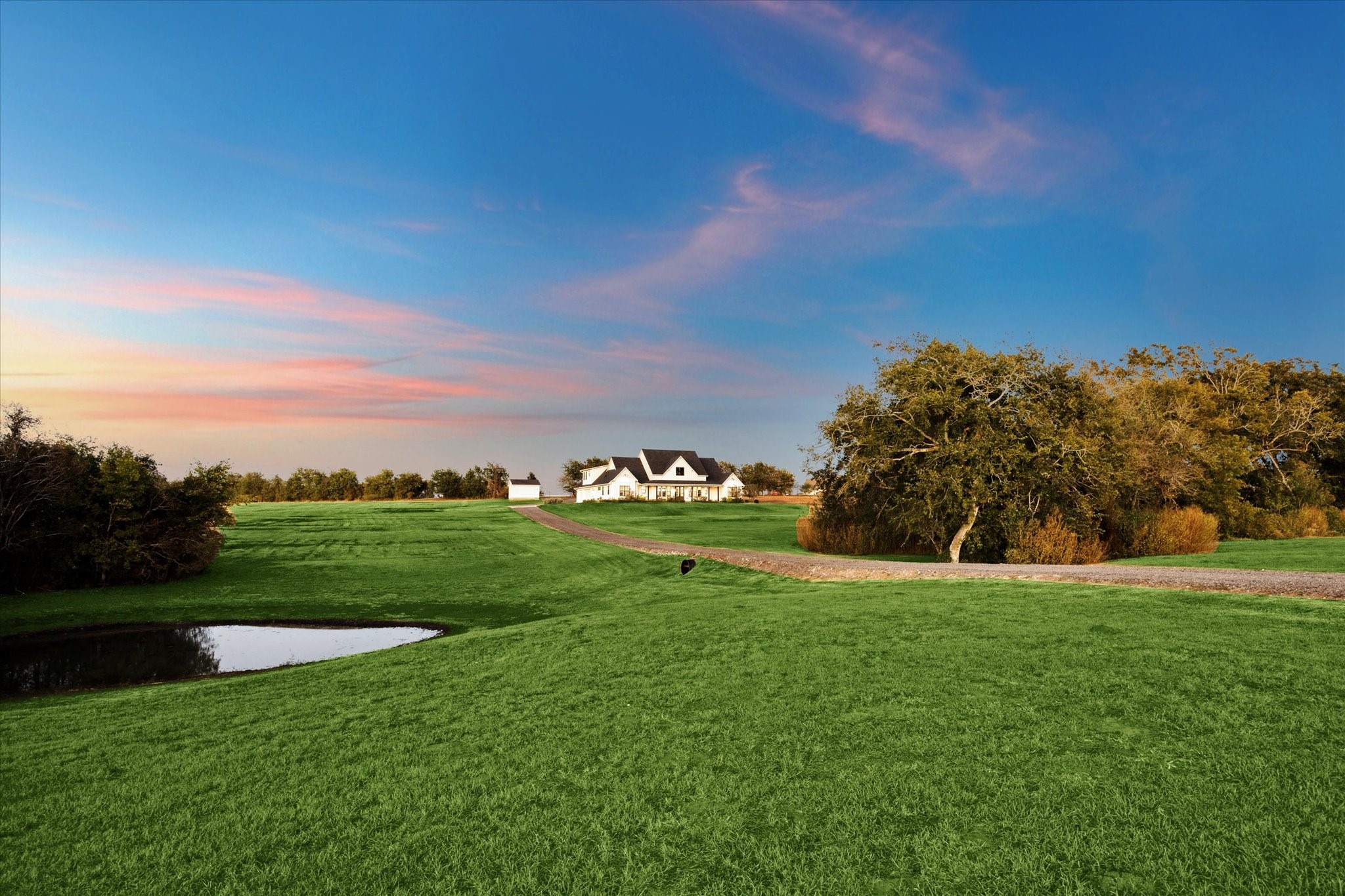 1009 Century Terrace Brenham, TX 77833 - Photo 2 of 49 a view of a golf course with a garden
