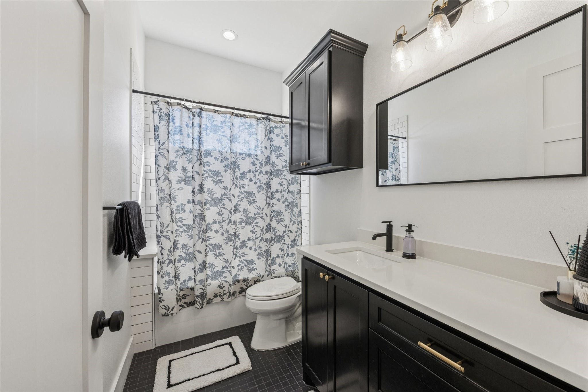 1009 Century Terrace Brenham, TX 77833 - Photo 25 of 49 a bathroom with a sink toilet and shower