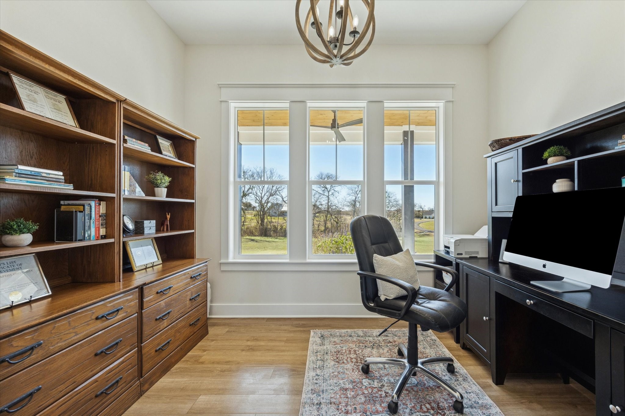 1009 Century Terrace Brenham, TX 77833 - Photo 29 of 49 a view of a workspace with furniture and a window