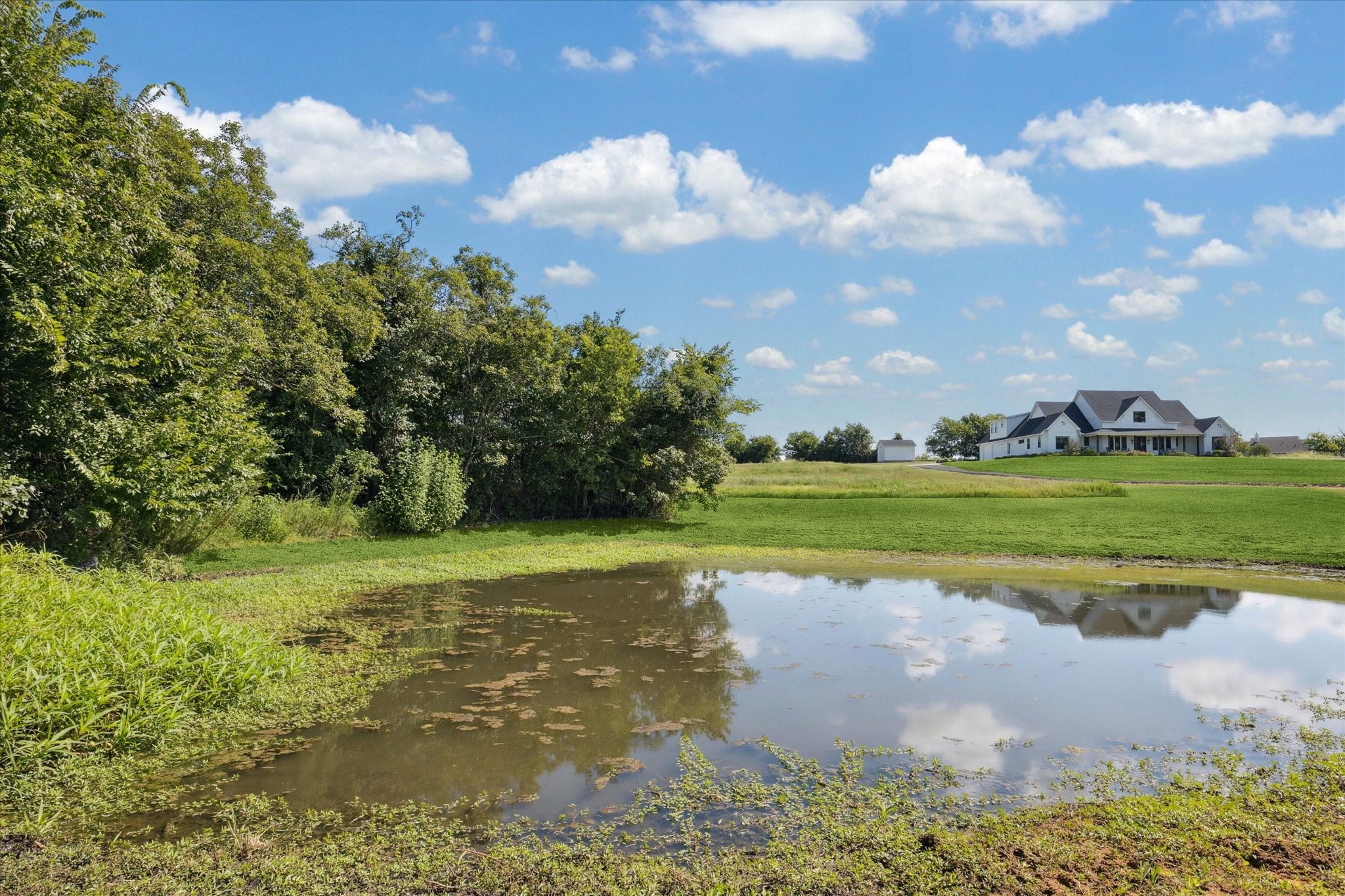 1009 Century Terrace Brenham, TX 77833 - Photo 10 of 49 a view of a golf course with a lake