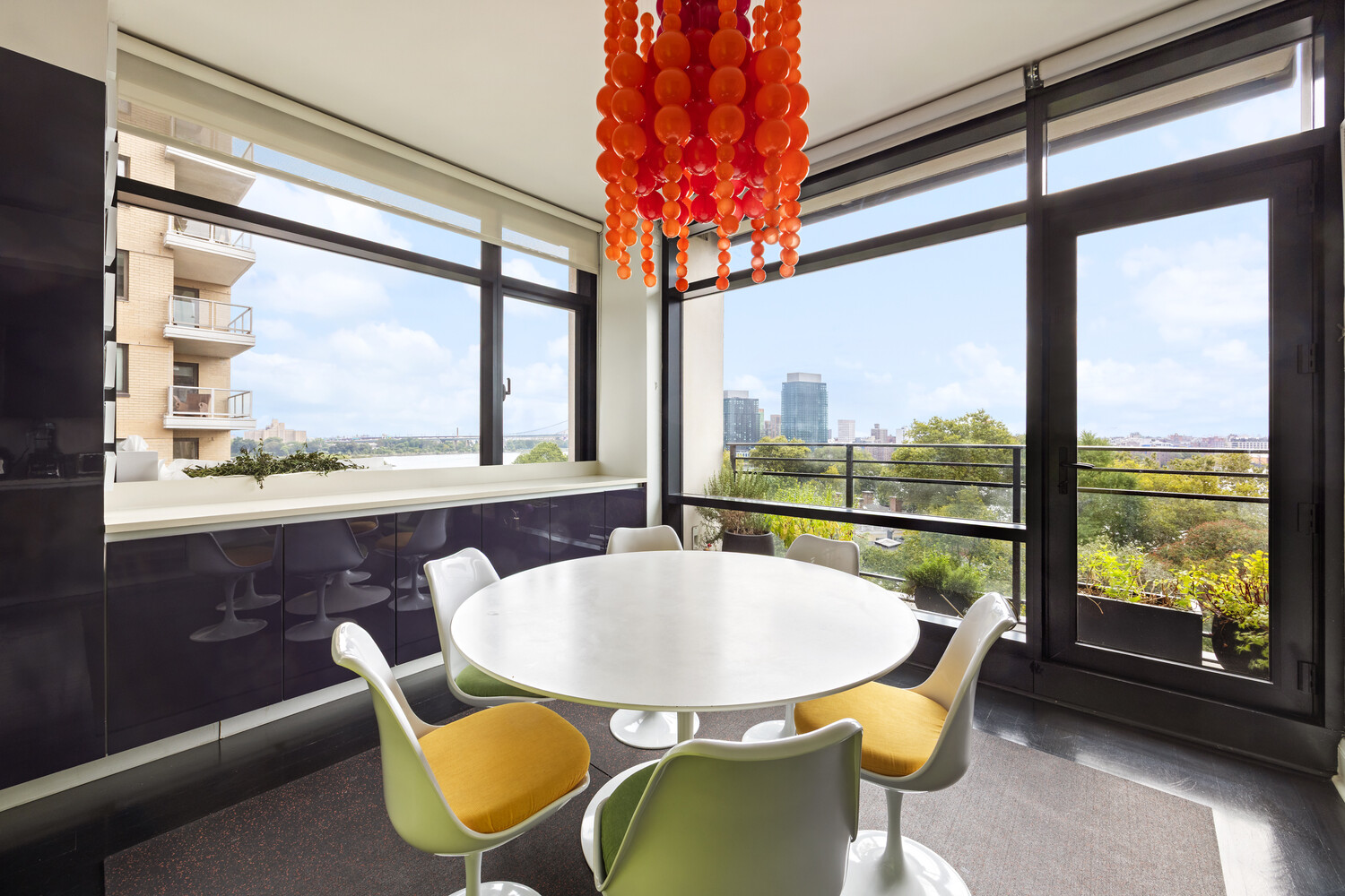 170 East End Avenue, Unit 8EF Manhattan, NY 10128 - Photo 9 of 31 a view of a dining room with furniture window and outside view