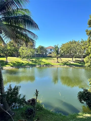 a view of a lake with a yard