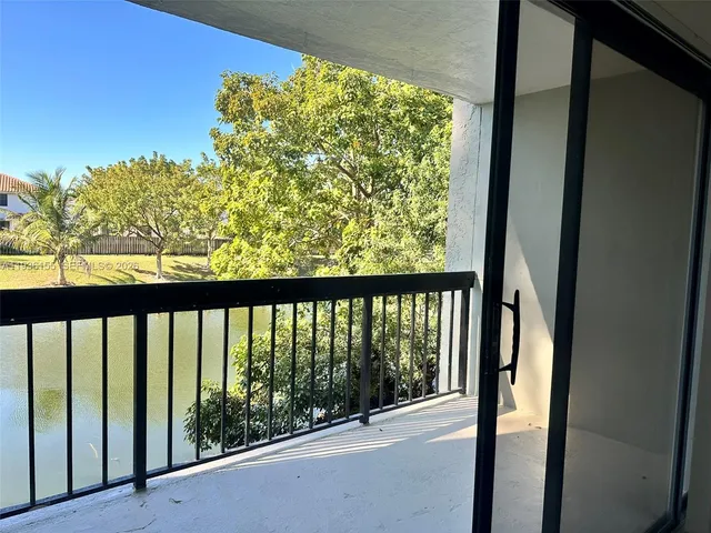 a view of a glass door with a balcony